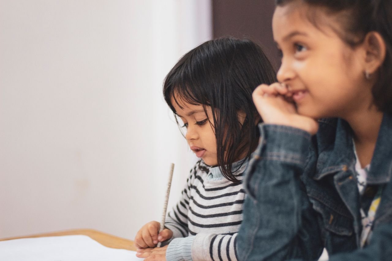 Children learning with teacher at Wisdom Kids primary tuition centre in Hougang